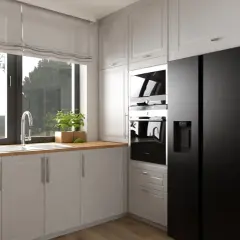 Nowoczesna kuchnia z wysoką zabudową, czarną lodówką i piekarnikami, jasnymi frontami szafek i drewnianym blatem.