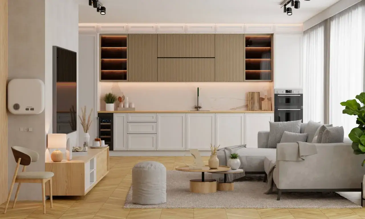 Nowoczesne pok&oacute;j z kuchnią aranżacje: jasne meble, szara sofa, drewniane akcenty i elegancka zabudowa kuchenna.
