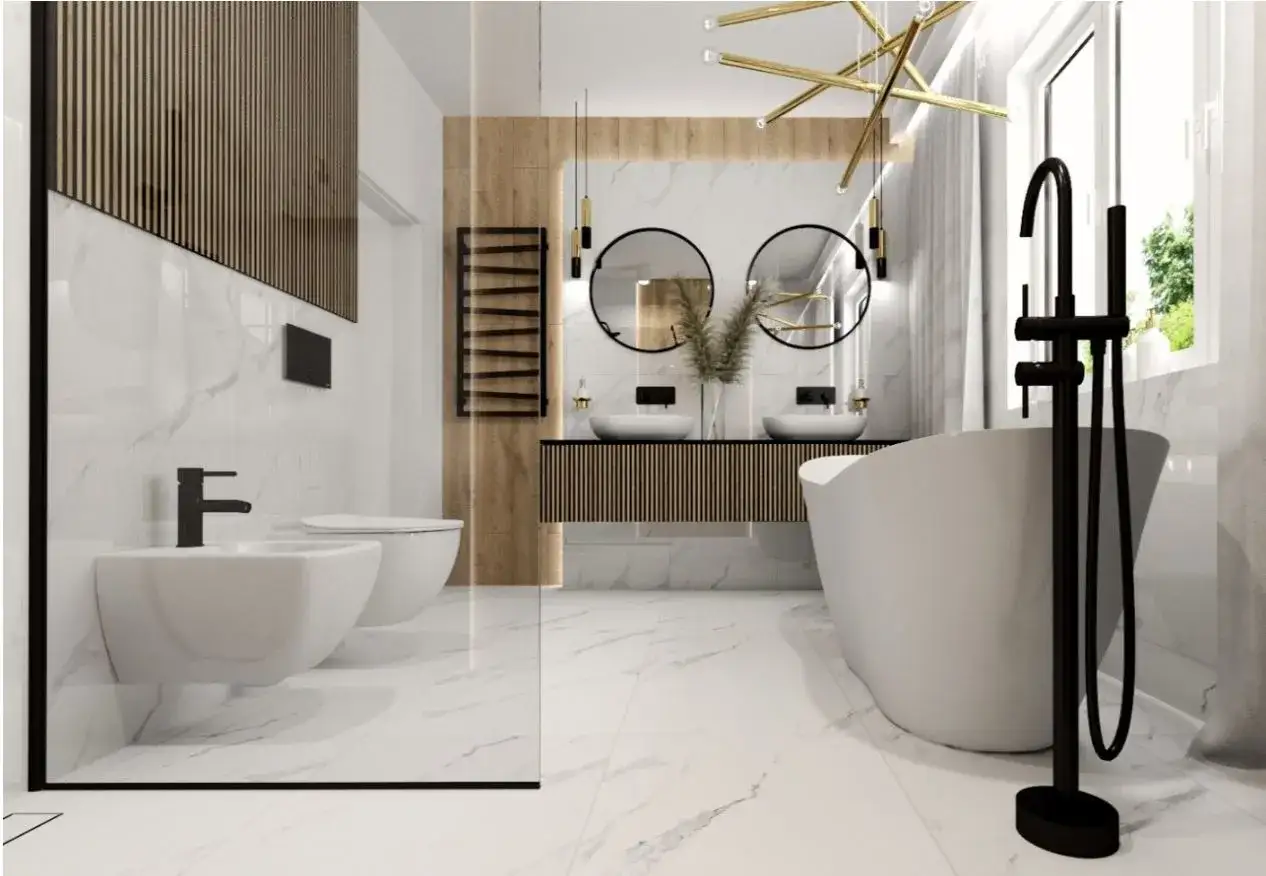 Nowoczesna łazienka z wolnostojącą wanną i czarną baterią stojącą. Obok bidet i toaleta.